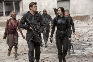 Katniss (Jennifer Lawrence, right) is reunited with Gale (Liam Hemsworth, left) to lead a rebellion in "The Hunger Games: Mockingjay - Part 1". Photo by Murray Close.