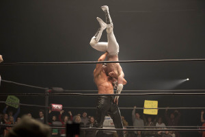 The Reaper (James Preston Rogers) suplexes The Masked Saint (Brett Granstaff).